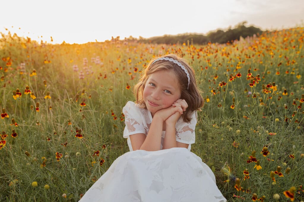 8 year old girl warmly smiling at the camera. 