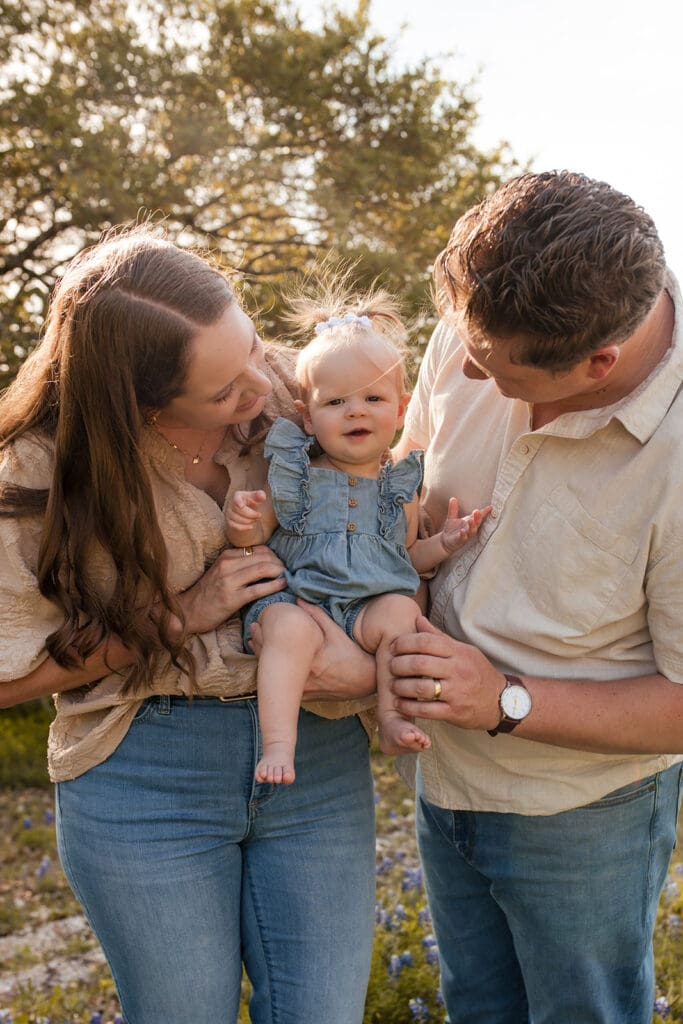 Loving family portrait surrounded by blooming bluebonnets in Bulverde

