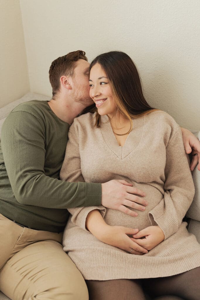 Relaxed indoor maternity photo session with glowing expectant mother