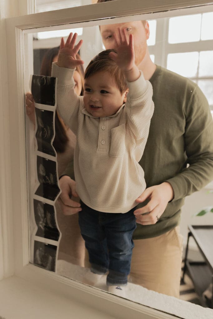 Capturing sibling happy emotions during indoor maternity photography in Bulverde Texas