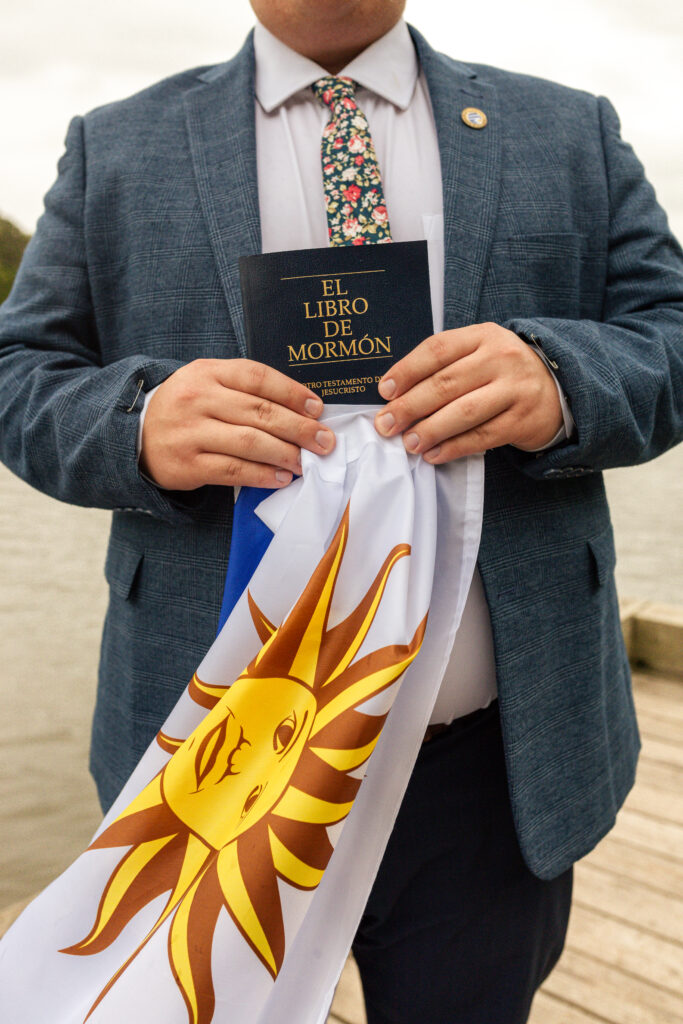 LDS missionary photo with mission call and country flag outdoors

